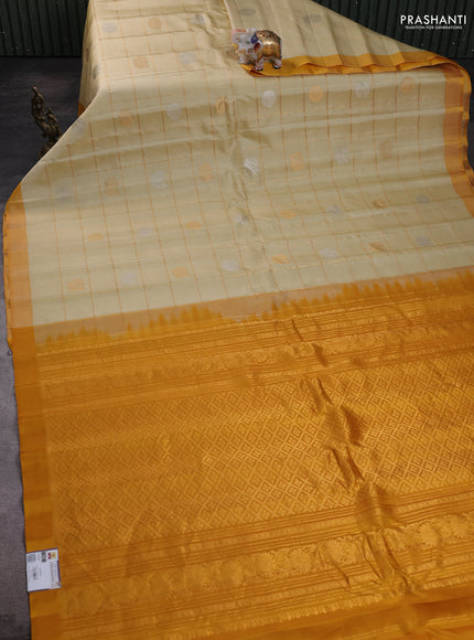 Pure gadwal silk saree cream and mustard yellow with allover zari checks & buttas and simple boder