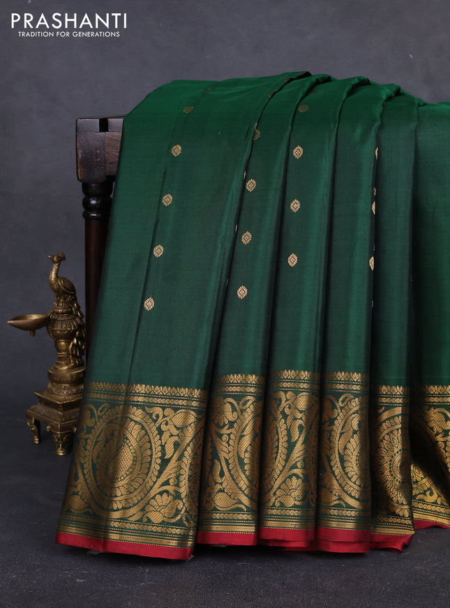 Pure gadwal silk saree bottle green with allover zari woven buttas and rich paisley zari woven border