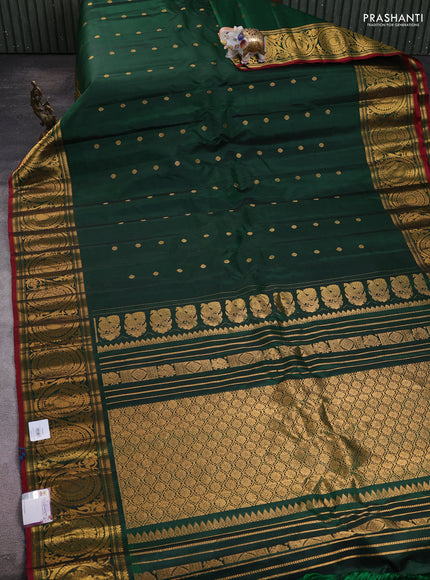 Pure gadwal silk saree bottle green with allover zari woven buttas and rich paisley zari woven border