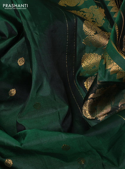 Pure gadwal silk saree bottle green with allover zari woven buttas and rich paisley zari woven border