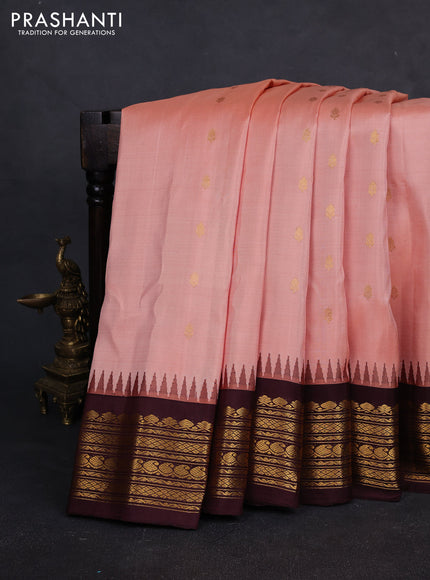 Pure gadwal silk saree peach orange and deep wine with allover zari woven buttas and rich zari woven border