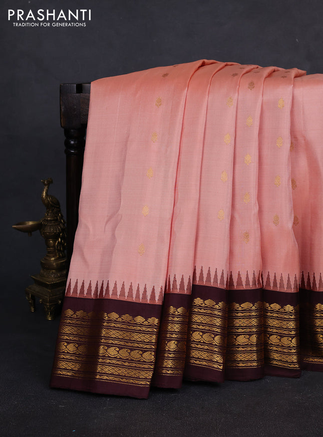 Pure gadwal silk saree peach orange and deep wine with allover zari woven buttas and rich zari woven border