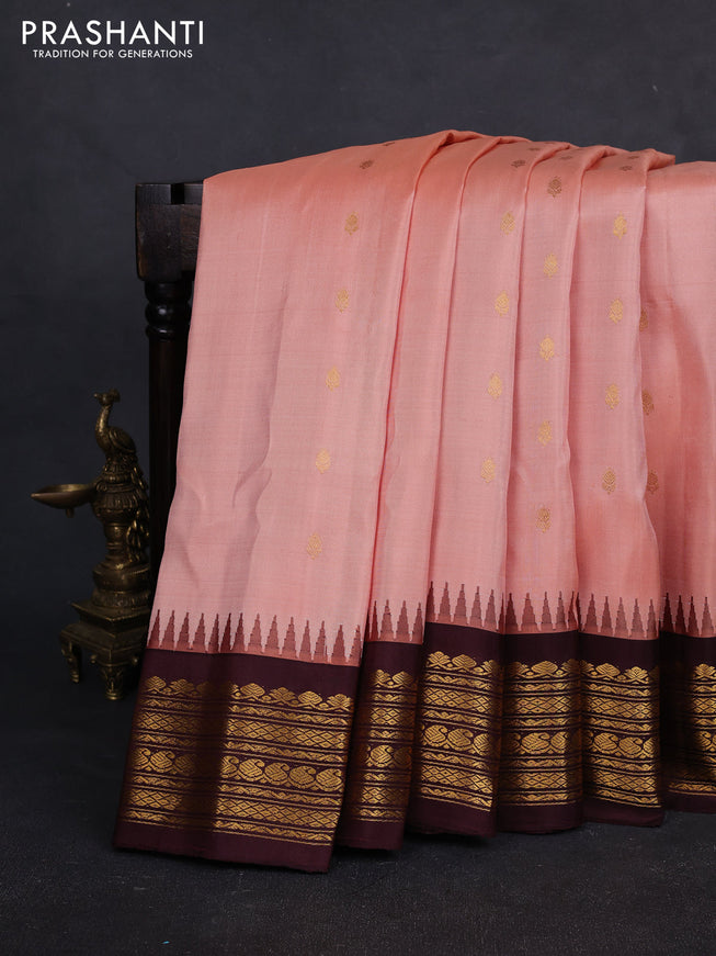 Pure gadwal silk saree peach orange and deep wine with allover zari woven buttas and rich zari woven border