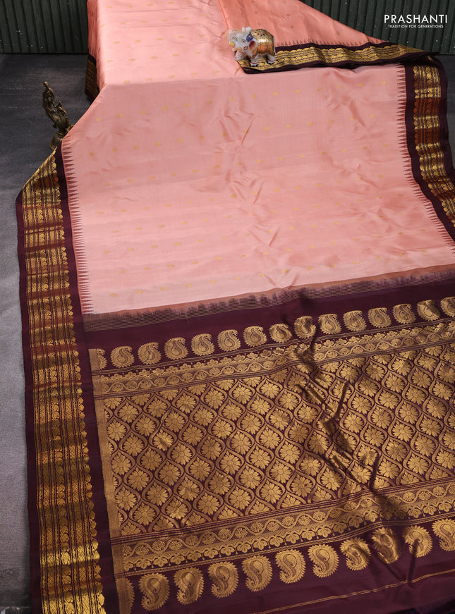 Pure gadwal silk saree peach orange and deep wine with allover zari woven buttas and rich zari woven border