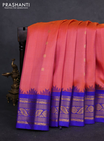 Pure gadwal silk saree peach orange and blue with allover zari woven buttas and temple design zari woven border