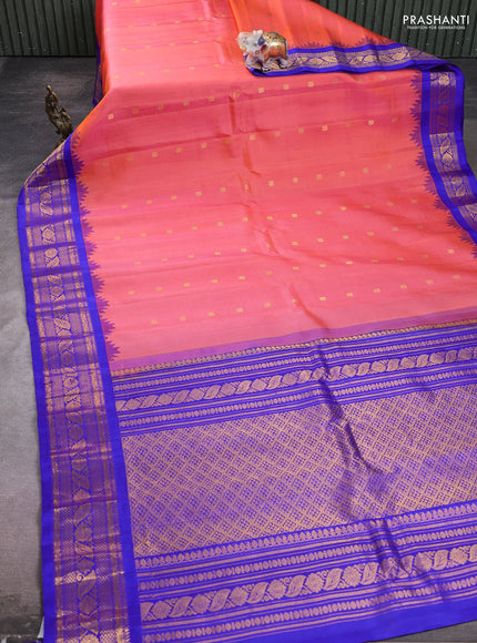 Pure gadwal silk saree peach orange and blue with allover zari woven buttas and temple design zari woven border