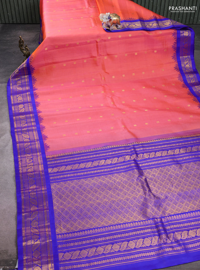 Pure gadwal silk saree peach orange and blue with allover zari woven buttas and temple design zari woven border