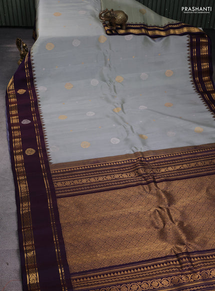 Pure gadwal silk saree grey and jamun shade with silver & gold zari woven buttas and rettapet zari woven border