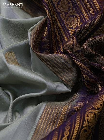 Pure gadwal silk saree grey and jamun shade with silver & gold zari woven buttas and rettapet zari woven border