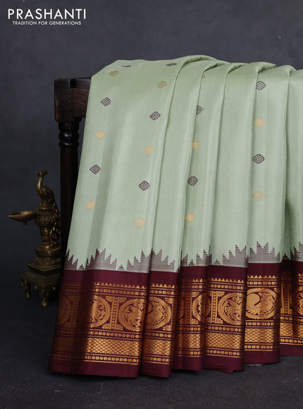 Pure gadwal silk saree pista green and deep maroon with thread & zari woven buttas and temple design zari woven border
