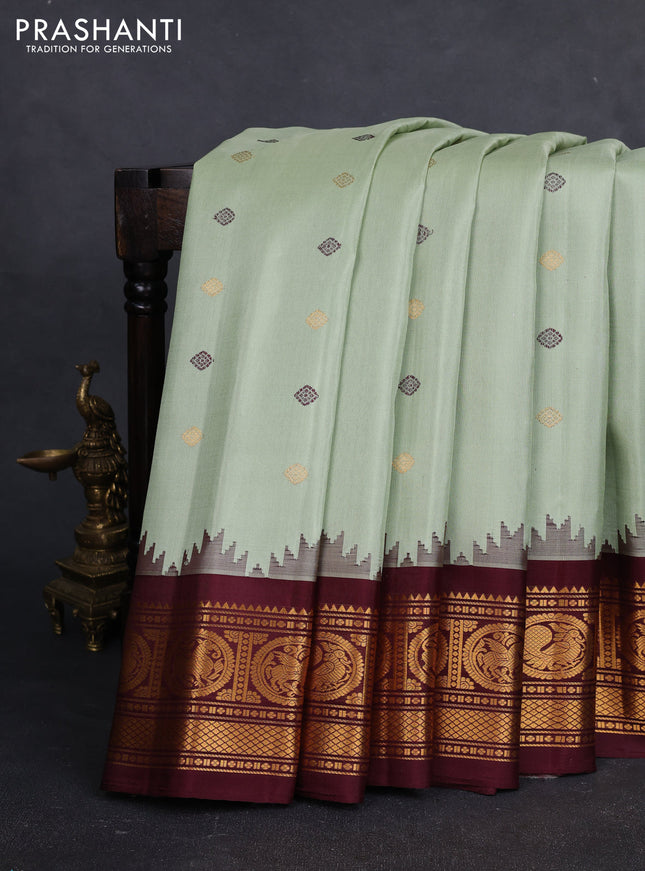 Pure gadwal silk saree pista green and deep maroon with thread & zari woven buttas and temple design zari woven border