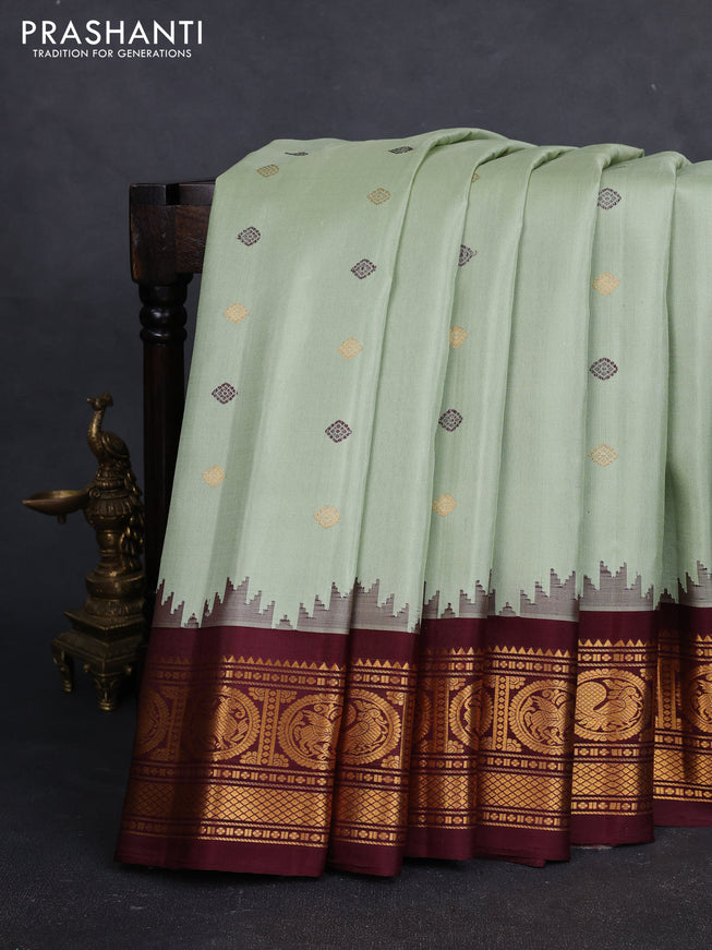 Pure gadwal silk saree pista green and deep maroon with thread & zari woven buttas and temple design zari woven border