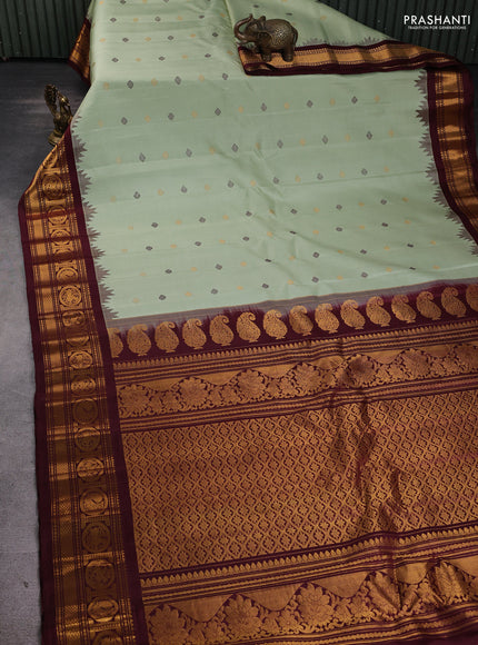 Pure gadwal silk saree pista green and deep maroon with thread & zari woven buttas and temple design zari woven border