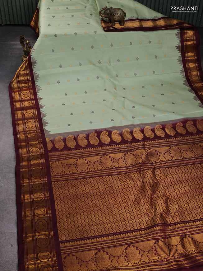 Pure gadwal silk saree pista green and deep maroon with thread & zari woven buttas and temple design zari woven border