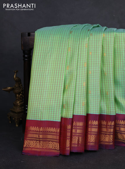 Pure gadwal silk saree pista green and maroon with allover checked pattern & zari buttas and zari woven border