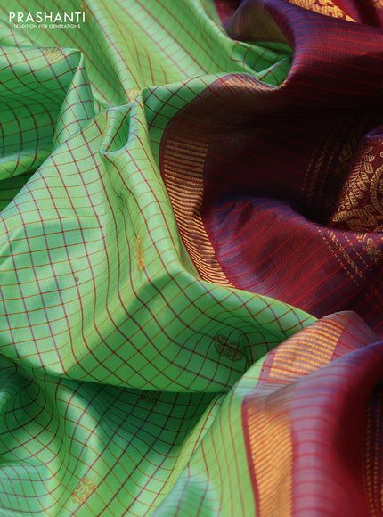 Pure gadwal silk saree pista green and maroon with allover checked pattern & zari buttas and zari woven border