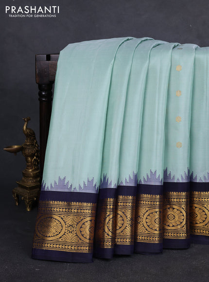 Pure gadwal silk saree pastel green and navy blue with zari woven buttas and temple design zari woven border