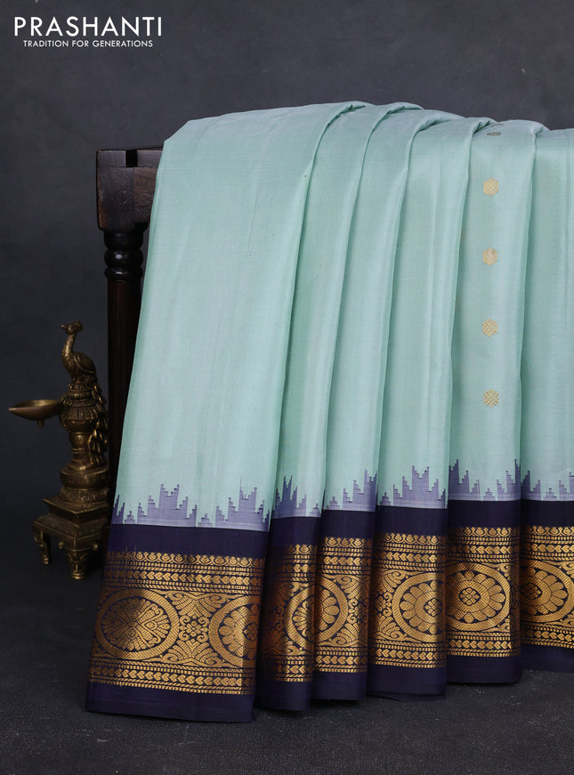 Pure gadwal silk saree pastel green and navy blue with zari woven buttas and temple design zari woven border