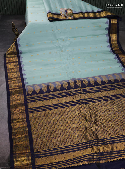 Pure gadwal silk saree pastel green and navy blue with zari woven buttas and temple design zari woven border