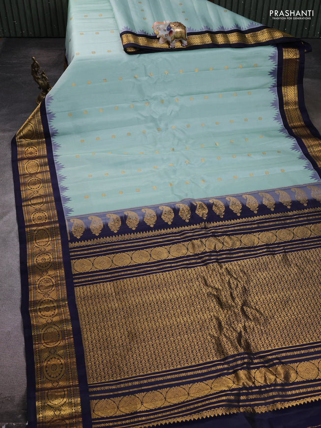 Pure gadwal silk saree pastel green and navy blue with zari woven buttas and temple design zari woven border