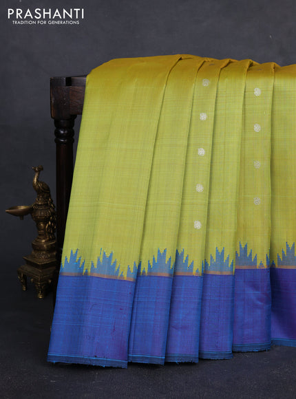 Pure gadwal silk saree lime green and dual tone bluish purple with silveer zari woven paisley buttas and temple design simple border
