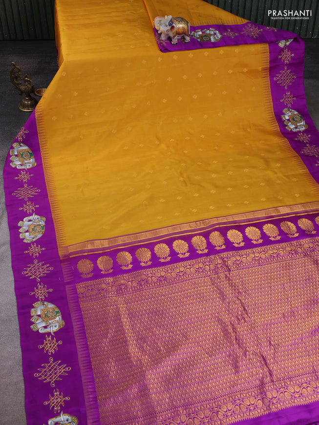 Pure Gadwal Silk Saree Yellow and Purple with zari woven buttas and temple design tanjore paint border
