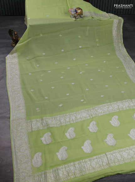 Banarasi Chiffon Saree pista green with silver zari woven buttas and silver zari woven floral border