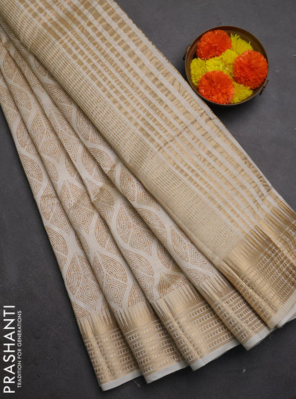 Semi Raw Silk Saree cream with allover butta prints and zari woven border