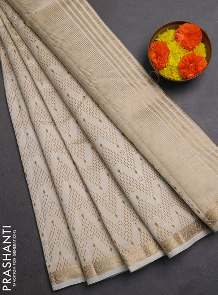 Semi Raw Silk Saree cream with allover zig zag prints and zari woven border