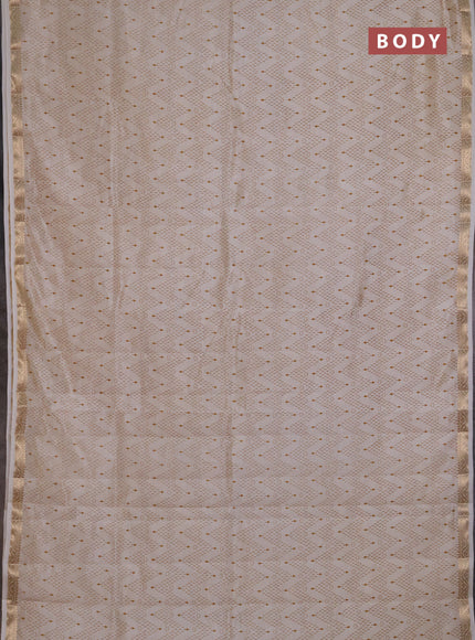 Semi Raw Silk Saree cream with allover zig zag prints and zari woven border