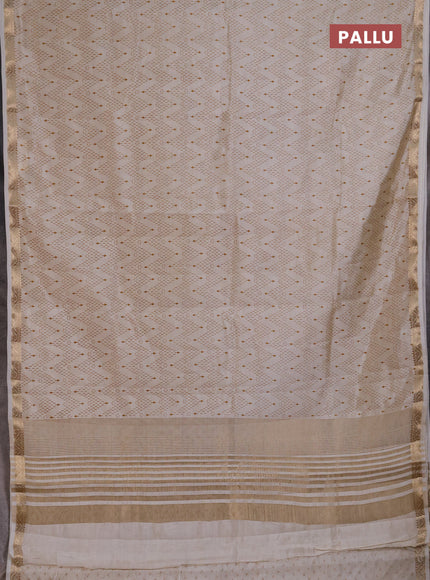 Semi Raw Silk Saree cream with allover zig zag prints and zari woven border