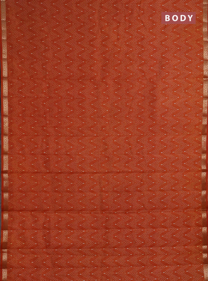 Semi Raw Silk Saree rust shade with allover zig zag prints and zari woven border