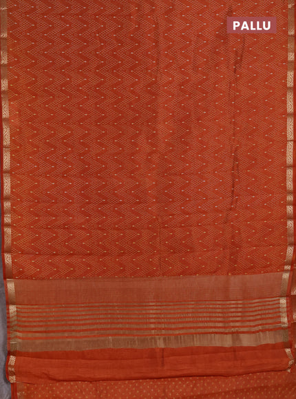 Semi Raw Silk Saree rust shade with allover zig zag prints and zari woven border