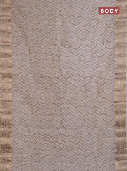 Semi Raw Silk Saree cream with allover zig zag prints and zari woven border