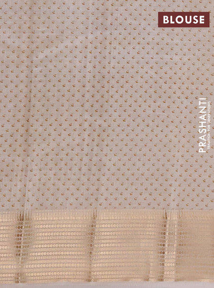 Semi Raw Silk Saree cream with allover leaf butta prints and zari woven border