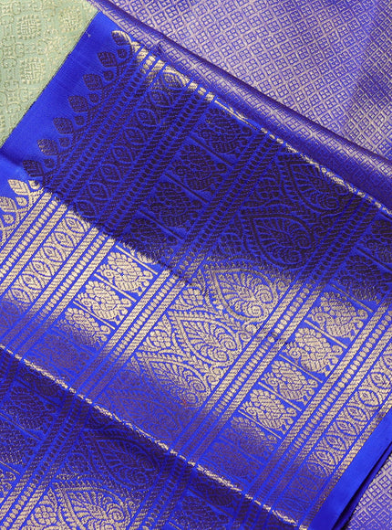 Pure kanchipuram Silk Saree pista green and royal blue with allover zari woven brocade weaves and long rich zari woven korvai border