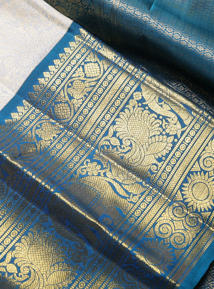 Pure kanchipuram Silk Saree pastel grey and peacock green with allover zari woven brocade weaves and long rich zari woven korvai border