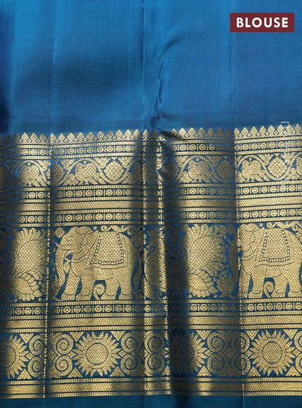 Pure kanchipuram Silk Saree pastel grey and peacock green with allover zari woven brocade weaves and long rich zari woven korvai border