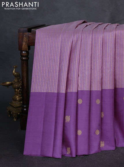 Pure Kanchipuram Silk Saree pastel purple and mild purple with allover silver & gold zari weaves and long zari woven butta border