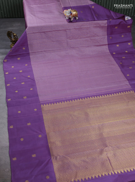 Pure Kanchipuram Silk Saree pastel purple and mild purple with allover silver & gold zari weaves and long zari woven butta border