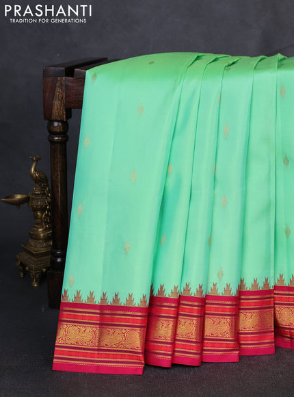 Pure Kanchipuram Silk Saree pista green and pink with zari woven buttas and temple design zari woven border