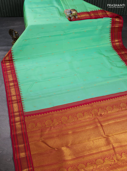 Pure Kanchipuram Silk Saree pista green and pink with zari woven buttas and temple design zari woven border