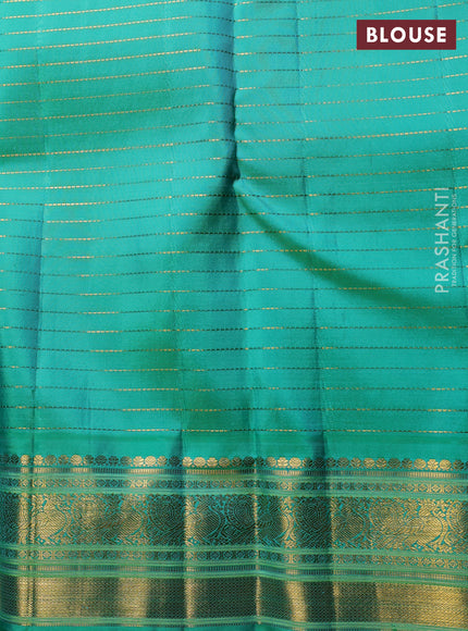 Pure Kanchipuram Silk Saree purple and green with allover zari woven checked pattern and rich annam zari woven border