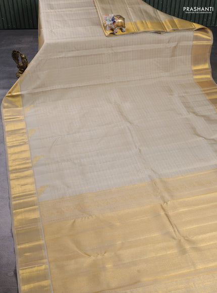 Pure Kanchipuram Silk Saree beige with allover zari woven checked pattern and rich zari woven border
