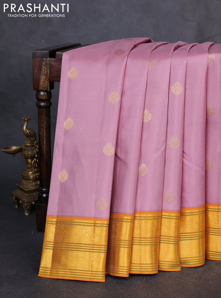 Pure Kanchipuram Silk Saree pastel pink and mustard yellow with zari woven buttas and rich zari woven border
