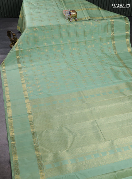 Pure Kanchipuram Silk Saree pista green with allover zari checks & buttas and rich zari woven border