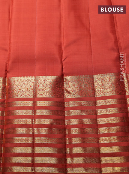 Pure Kanchipuram Silk Saree rust shade with zari woven buttas and long zari woven border