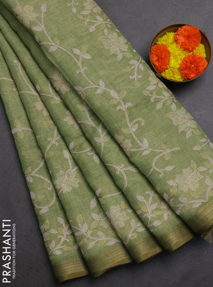 Linen Cotton Saree light green with allover embroidery work and zari woven border