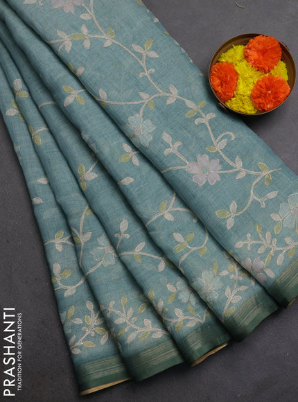 Linen Cotton Saree teal green shade with allover embroidery work and zari woven border