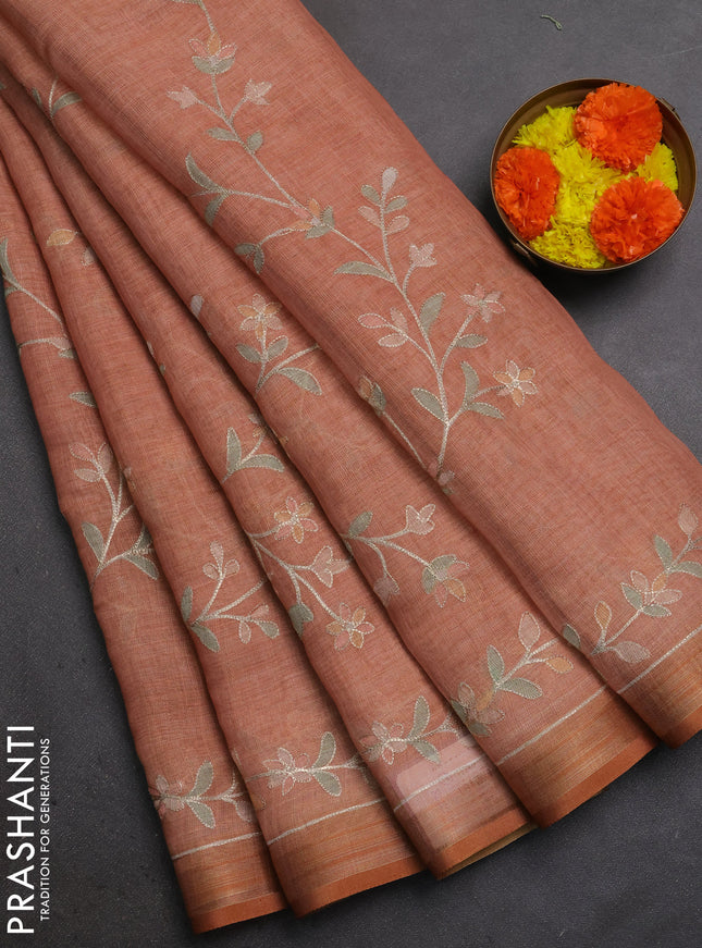 Linen Cotton Saree rust shade with allover embroidery work and zari woven border